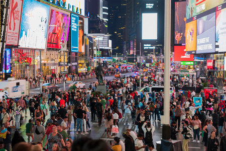Beautiful night view of Time Square with red staircase where people are walking along Broadway. New York. USA.のeditorial素材