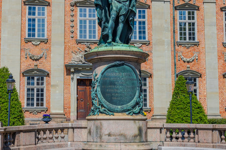 Close-up view of information desk under historic statue of Gustavo Erici in front of Riddarhuset (House of Nobility) in Stockholm, Sweden.のeditorial素材