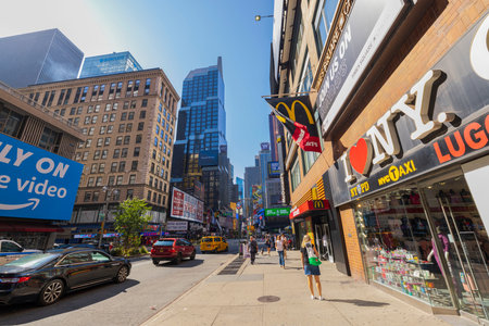 Beautiful view of one of the streets of Manhattan, New York, against a blue sky on a sunny day. New...