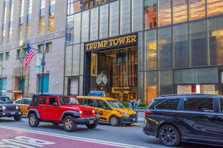 Beautiful view of the grand entrance of Trump Tower in New York City, framed by bustling street...