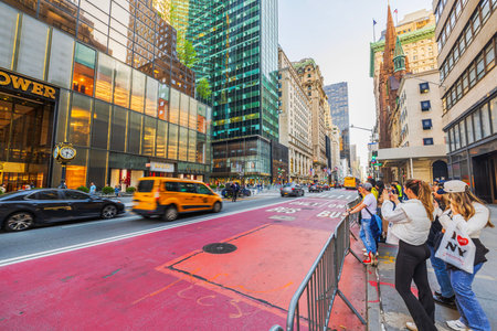 Beautiful view of the vibrant street scene in front of Trump Tower on New York's 5th Avenue,...