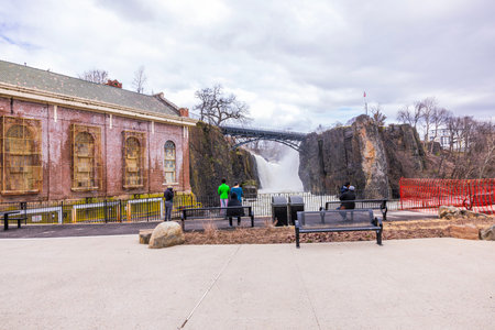 A beautiful view of Peterson Falls, where people are observing it from an observation deck. New...
