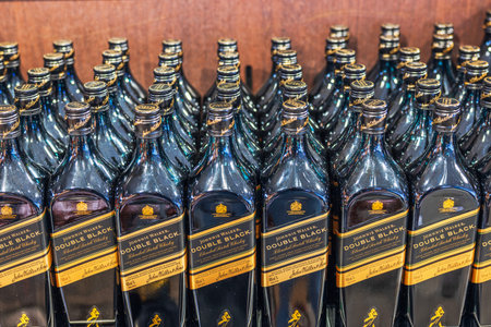 Close up view of bottles of Johnnie Walker Double Black on store shelf.のeditorial素材