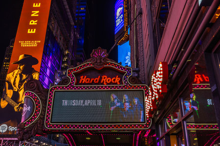 Hard Rock Cafe neon sign lit at night on Times Square with colorful billboards in New York City. USA.のeditorial素材