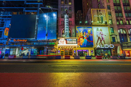 Times Square night view showcasing The Lion King Broadway theater, subway entrance and Aldo store. New York. USA.のeditorial素材