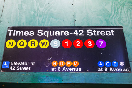 Times Square-42 Street subway sign displaying N, Q, R, W, S, 1, 2, 3, and 7 lines with B, D, F, M, A, C, E connections. New York. USA.の写真素材