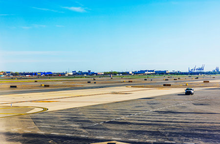 Runway at Newark Liberty International Airport with view of the IKEA building, shipping cranes. New...