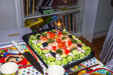 Seafood sandwich cake with sparkling number five for child's 5th birthday celebration.のeditorial素材