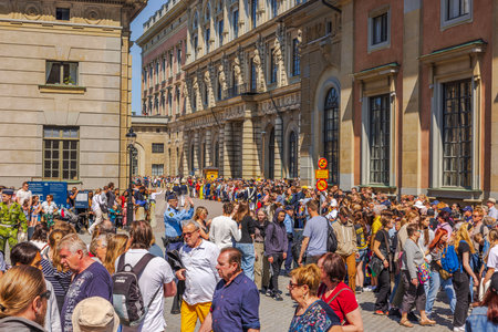 Crowd gathered on the square near the Royal Palace during Sweden's National Day celebration. Sweden. Stockholm.のeditorial素材