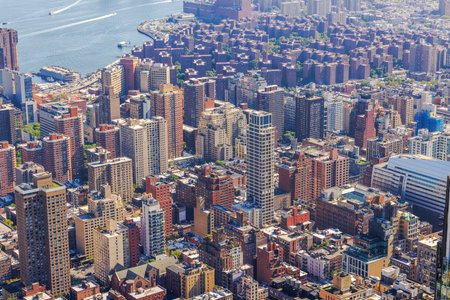 Aerial view of densely packed residential skyscrapers and streets near the East River in New York City. USA.の写真素材