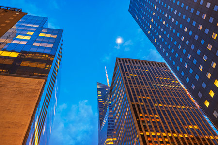 Beautiful view of illuminated skyscrapers against deep blue evening sky in Manhattan. New York. USA.の写真素材