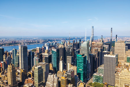 Aerial view of Midtown Manhattan skyscrapers with Hudson River and distant cityscape on clear day. New York. USA.の写真素材