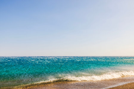 Offshore wind pushes sea waves away from shore on Aegean Sea coast of Crete island.の写真素材