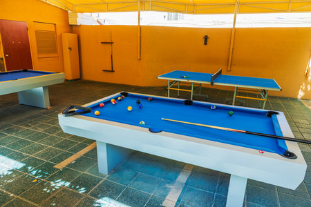 Close up view of hotel recreation area with billiard and ping pong tables. Aruba.