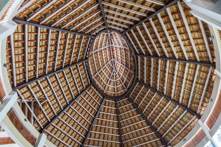 Close up view of large wooden dome ceiling with geometric pattern structure inside tropical resort building. Punta Cana. Dominican Republic.の写真素材