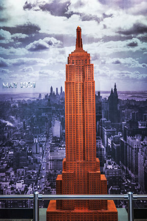 Close up view of Empire State Building art installation showing historical May 1931 city skyline...