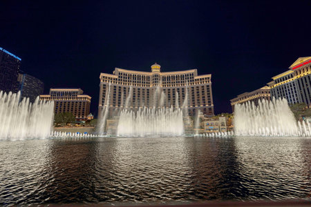 Beautiful night view of Bellagio fountains with illuminated hotel building on Las Vegas Strip. Las Vegas. USA.のeditorial素材