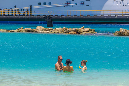 Beautiful view of tourists relaxing in turquoise water near cruise port in Curacao in Caribbean Sea.のeditorial素材