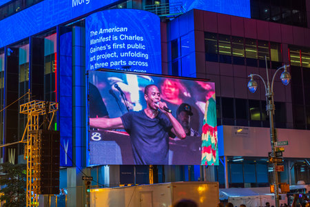Beautiful view of giant digital screen with live concert performance in Times Square New York at...