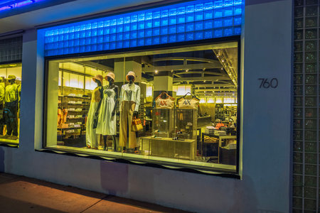 Close up view of Armani Exchange store window with mannequins showing stylish fashion collection....