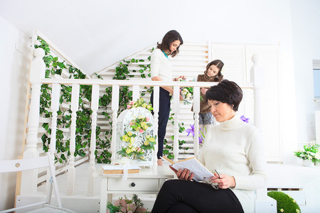 Cute little girl, her mother and grandmother together on this portraitの写真素材