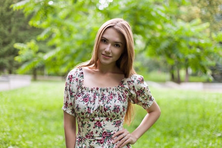 beautiful young woman smiles in the parkの写真素材