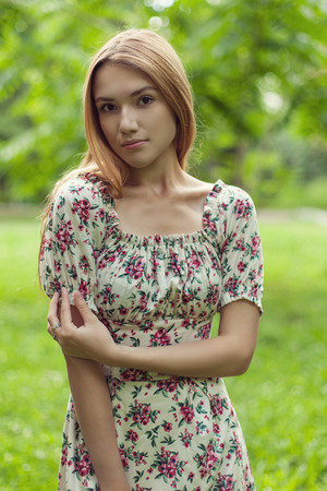 Young adult girl in spring parkの写真素材