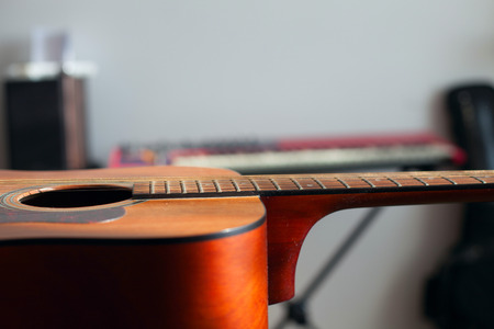 Acoustic guitar lying on the tableの写真素材