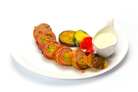 Tasty pork with oven potatoes on the plateの写真素材