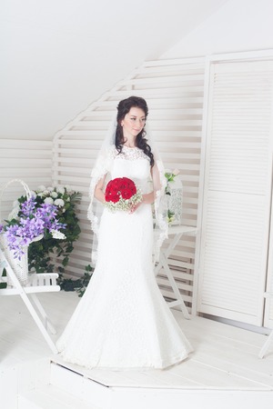 A beautiful bride poses for a photoの写真素材