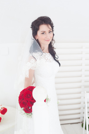 A beautiful bride poses for a photoの写真素材