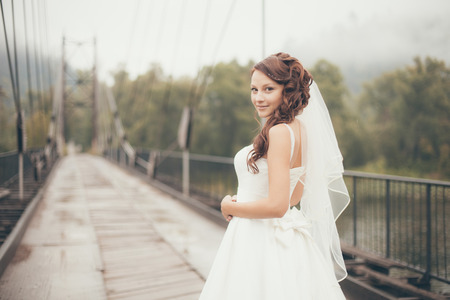 view bride standing on the bridge of the riverの写真素材