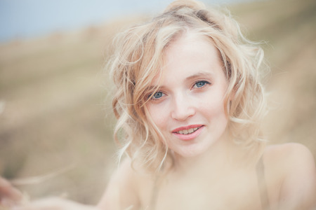 Portrait of Blonde Woman on Nature Backgroundの写真素材