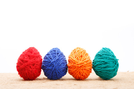 Colorful decorated easter eggs from wool yarn. Happy Easter.の写真素材