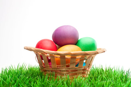 Colorful decorated easter eggs on green grass. Happy Easter.
