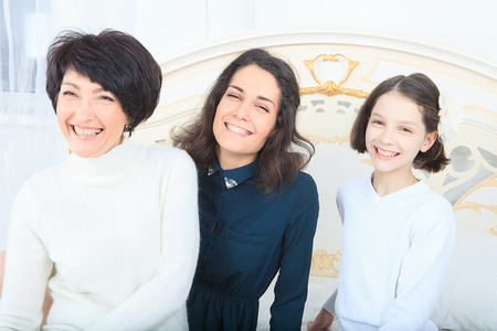 Multi-generation family portrait smiling at the camera  の写真素材