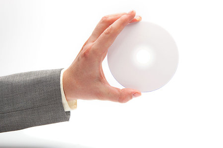 Hand in latex glove holding compact disc