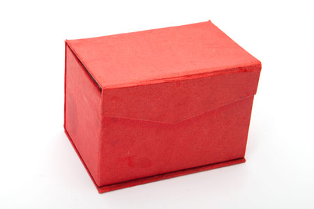 Close red  treasure box  with jewelry on white
