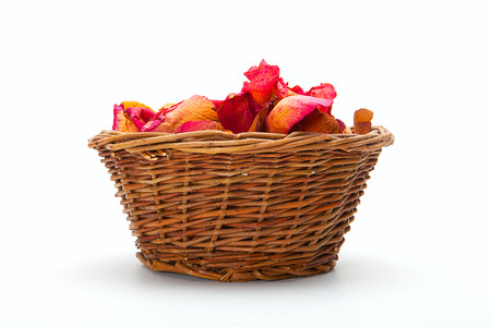 beautiful bouquet of roses in basket isolated on whiteの写真素材