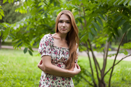 Young adult girl in spring parkの写真素材