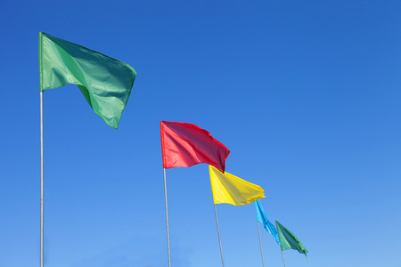 Colored flags on sky backgroundの写真素材