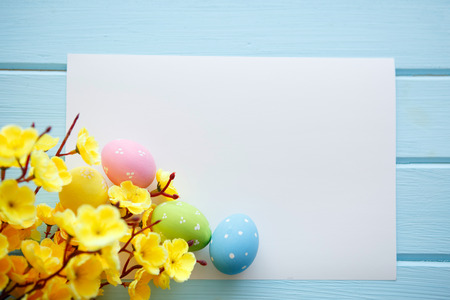 Colorful decorated easter eggs on white wood background. Happy Easter.の写真素材