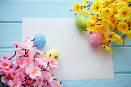 Colorful decorated easter eggs on white wood background. Happy Easter.の写真素材