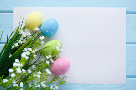 Colorful decorated easter eggs on white wood background. Happy Easter.の写真素材