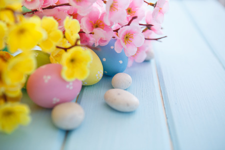 Colorful decorated easter eggs on white wood background. Happy Easter.の写真素材
