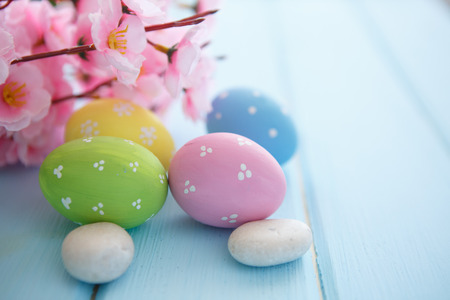 Colorful decorated easter eggs on white wood background. Happy Easter.の写真素材