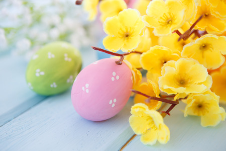 Colorful decorated easter eggs on white wood background. Happy Easter.の写真素材