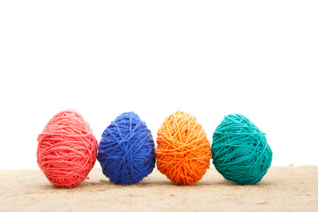 Colorful decorated easter eggs from wool yarn. Happy Easter.の写真素材