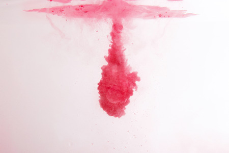 abstract pattern background with red ink in waterの写真素材