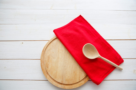 Wooden spoon and cutting board over wooden table with copy space. Diet Food concept.の写真素材